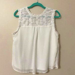 White sleeveless blouse with floral lace